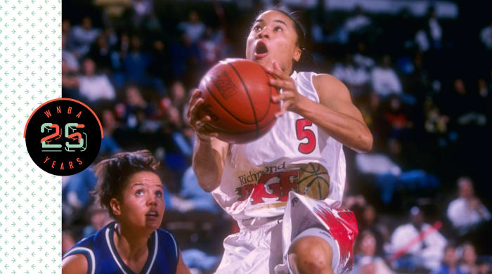 Dawn Staley holding a basketball